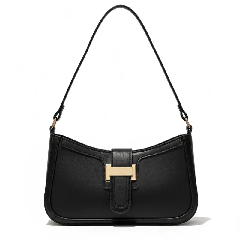 Bolsa de ombro feminina preta, vista frontal em estúdio. A foto destaca o formato baguette e o fecho de barra metálica dourada.