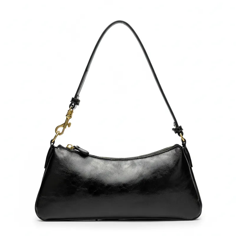 Vista superior da bolsa de ombro baguete preta aberta. A foto revela o interior com forro claro, bolsos internos e o fechamento por zíper.