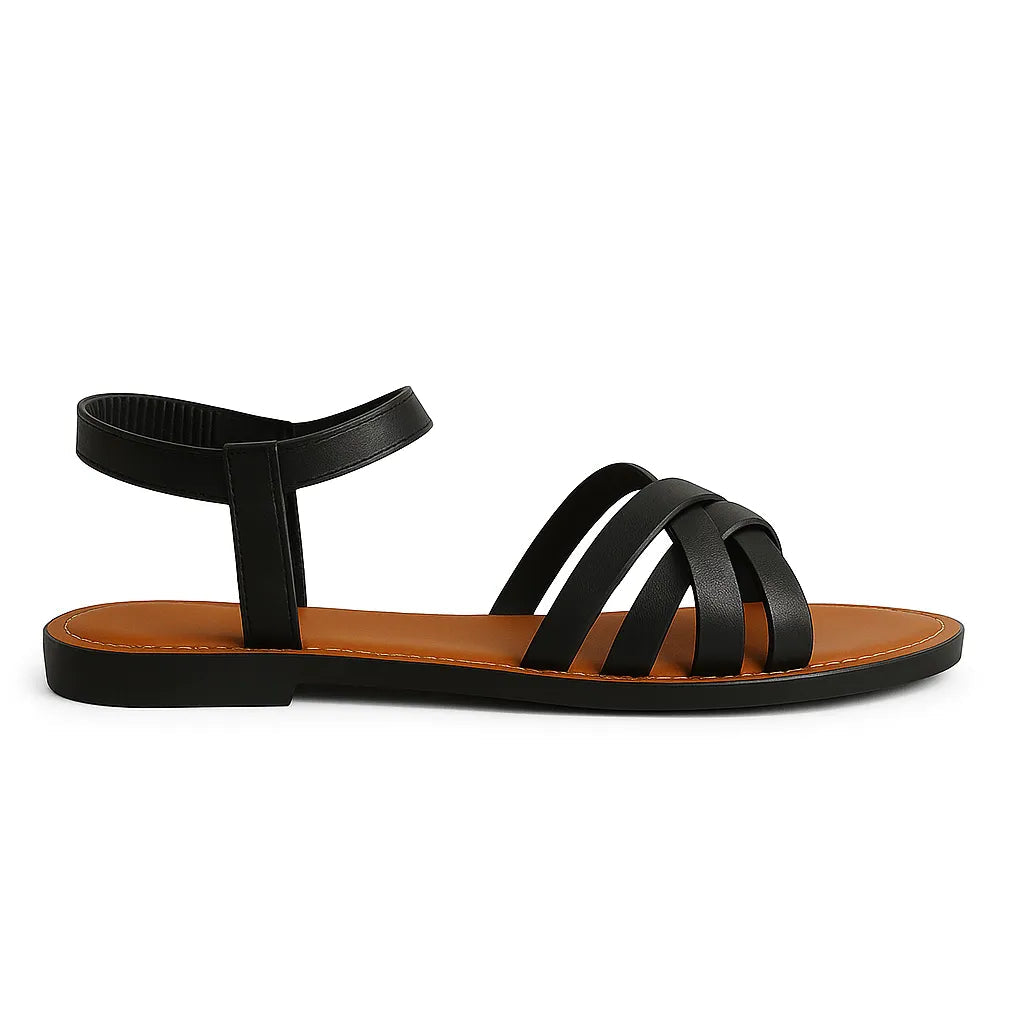 Sandália rasteira feminina preta com tiras cruzadas da Rozze. Vista lateral em estúdio, destacando o design minimalista, as tiras sintéticas e o solado de borracha.