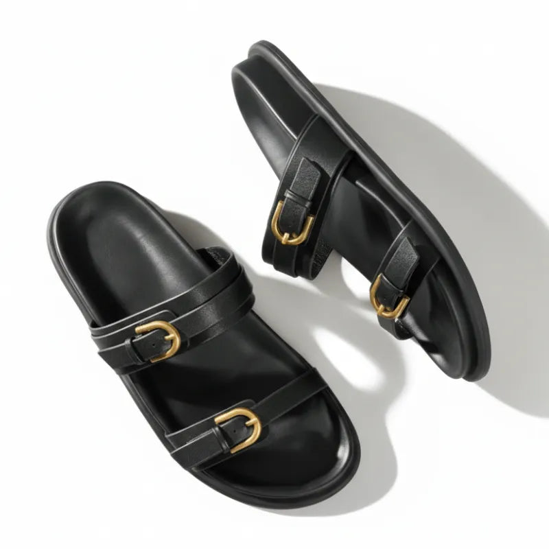 Papete preta com dupla fivela dourada vista de cima mostrando o par.