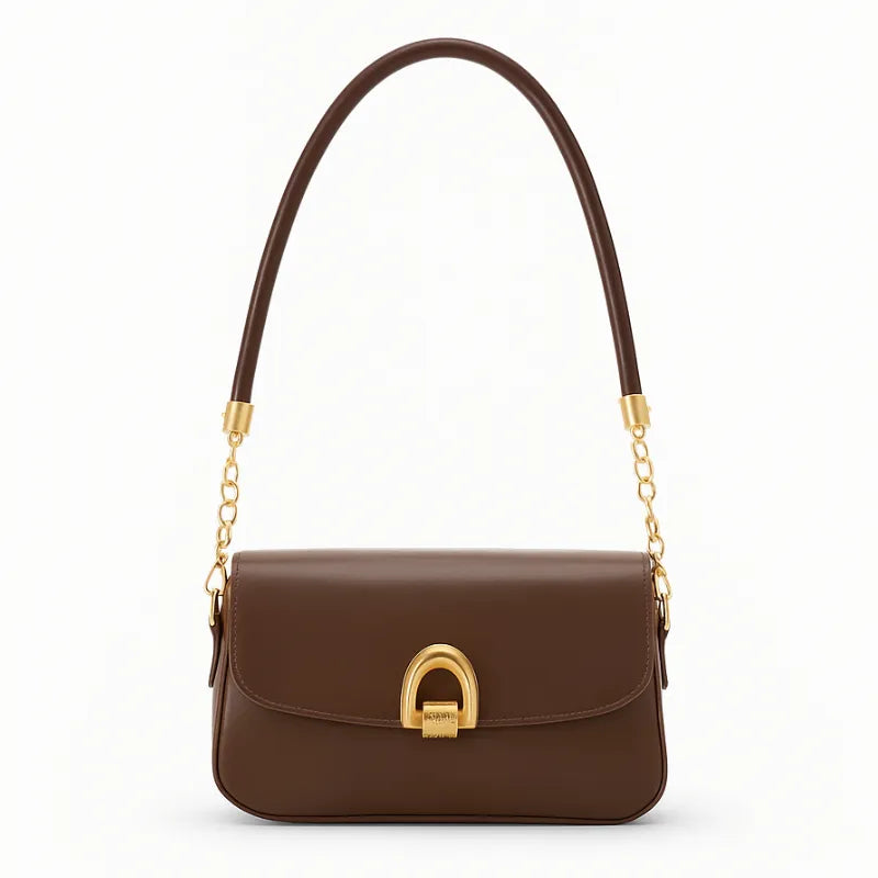 Bolsa baguete feminina marrom, vista frontal em estúdio. A foto destaca a alça curta trançada e o fecho metálico dourado com design exclusivo.