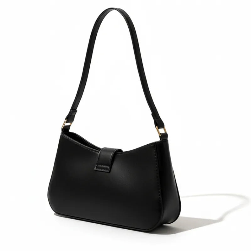 Bolsa de ombro preta em vista lateral. A foto exibe a forma do acessório e a estrutura semi-rígida.