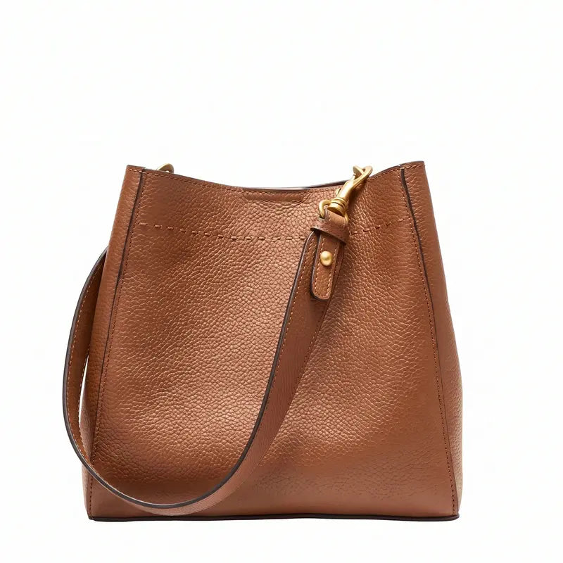 Bolsa bucket feminina marrom em couro legítimo em vista frontal, destacando formato, alça e acabamento do couro.