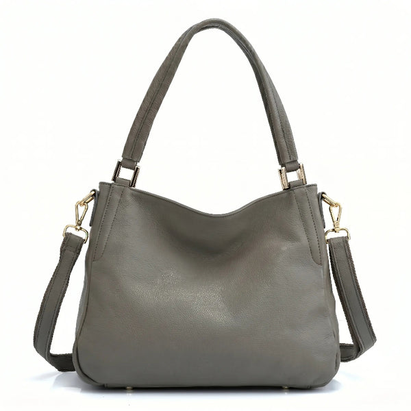 Bolsa hobo couro genuíno cinza retrô em ângulo três-quartos, mostrando formato, volume e alça, sobre fundo claro