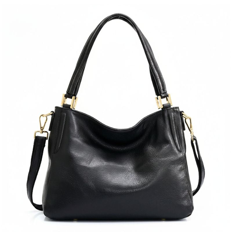 Bolsa hobo preta retrô em couro genuíno em composição principal, destacando o formato curvo, a alça e a textura do couro.
