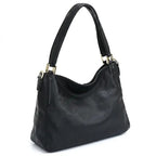 Bolsa hobo couro genuíno preta retrô em vista lateral, com profundidade, alça e acabamento visíveis, sobre fundo claro