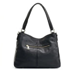 Bolsa hobo couro genuíno preta retrô vista por trás, com estrutura, costuras e acabamento posterior, sobre fundo claro