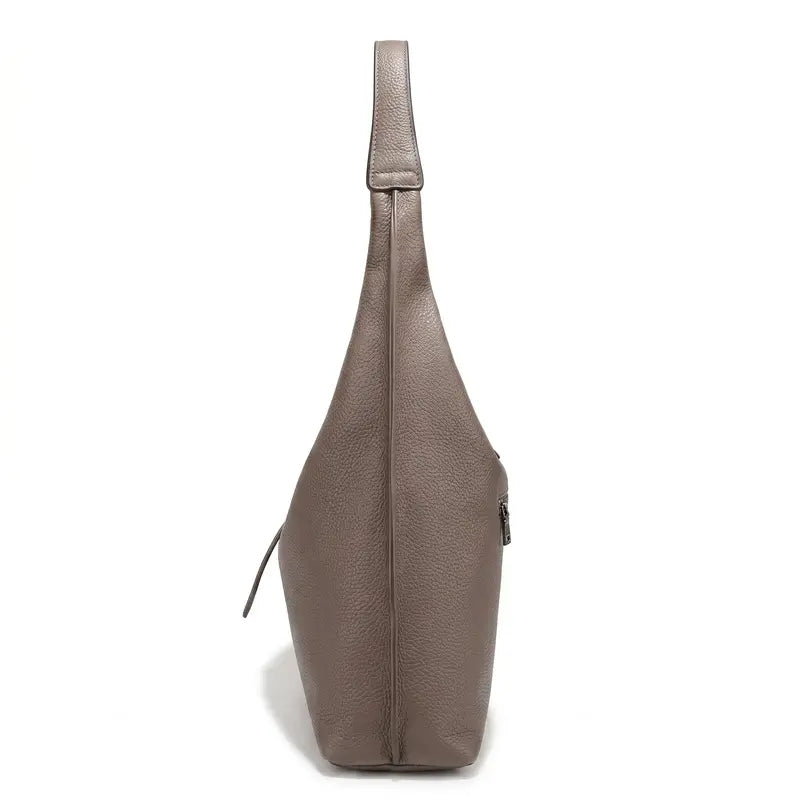 Bolsa tote feminina damasco em couro legítimo aberta por cima, com forro, zíper e compartimentos internos visíveis