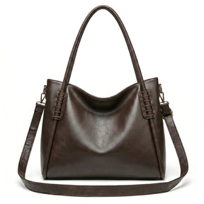 Bolsa hobo vintage marrom café em vista frontal, com formato, alça e ferragens visíveis, com acabamento uniforme