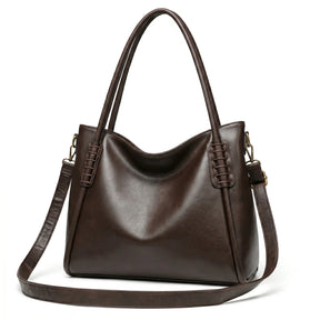 Bolsa hobo vintage marrom café em múltiplos ângulos, mostrando formato, volume e acabamento, sobre fundo claro